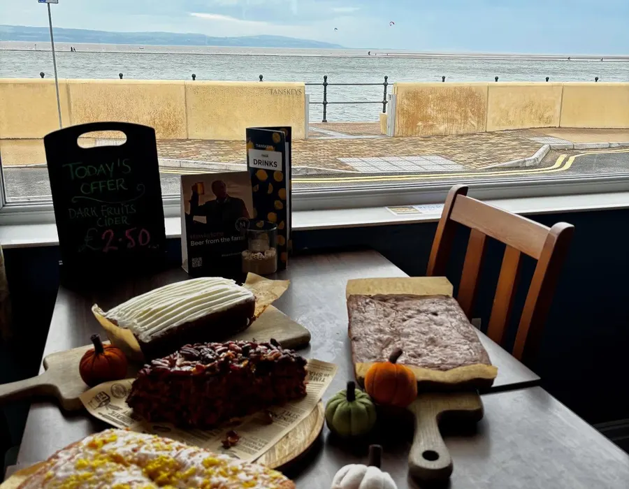 Homemade cake and coffee beside the water